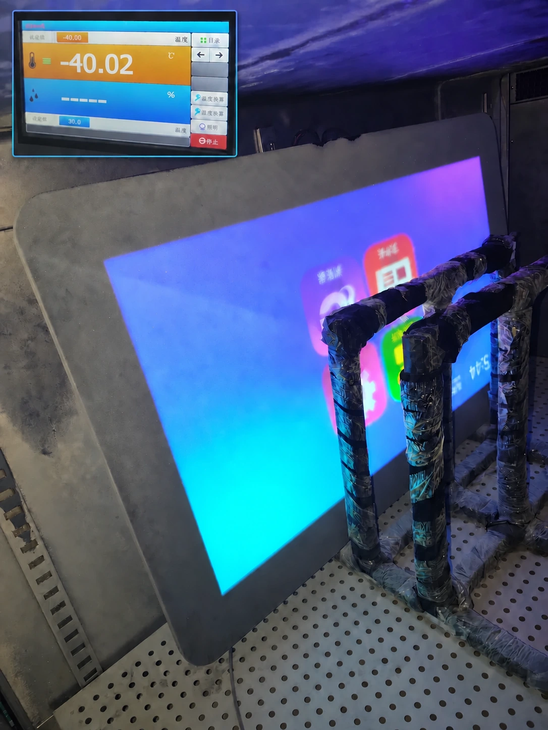 Display operating inside a climate chamber during environmental validation