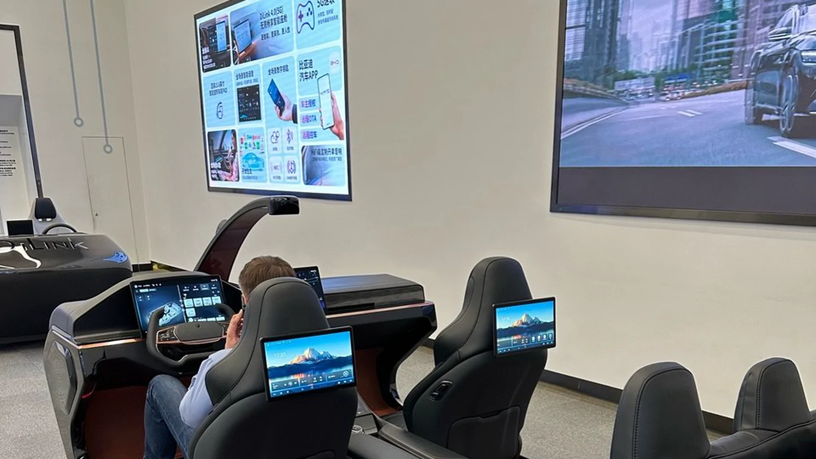 Custom multi-display automotive cockpit assembly with integrated passenger and control interfaces