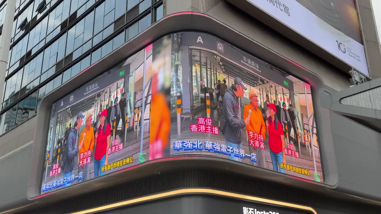Large direct-view LED facade wrapped around the corner of an urban building
